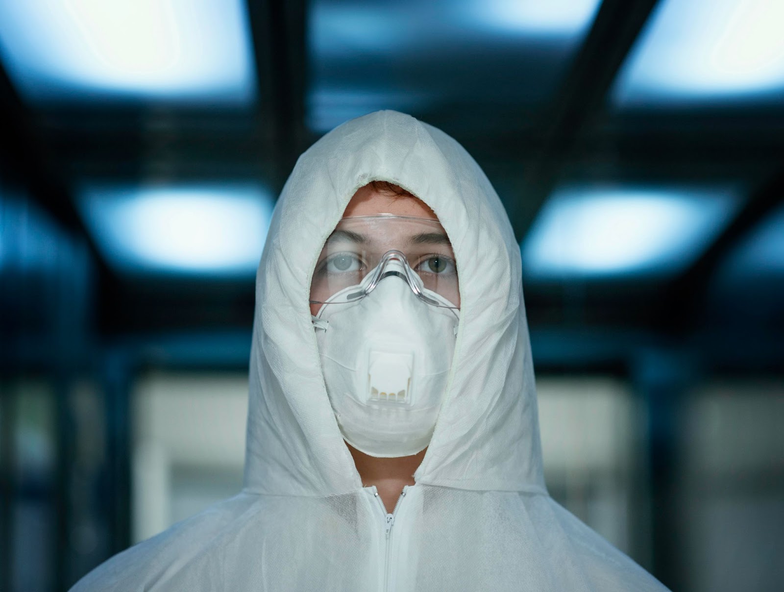 Person-with-face-mask-wearing-protective-equipment-against-bio-hazard